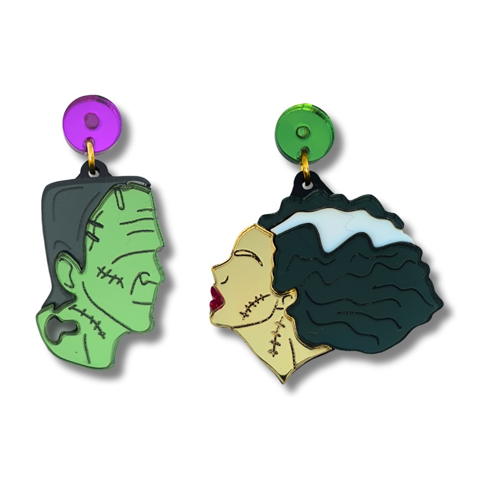 Pendientes de metacrilato espejo con el perfil de Frankenstein verde y de su novia de pelo negro y mechón blanco